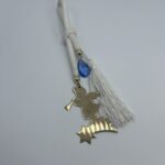 "Χρυσός Πρίγκιπας: Κρεμαστό Γεννητούρι σε Αστέρι με Μπλε Χάντρα"